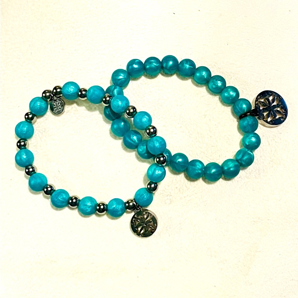 Yep Rustic Cuff rubber bracelets.  Turquoise or aqua in color.  Great condition